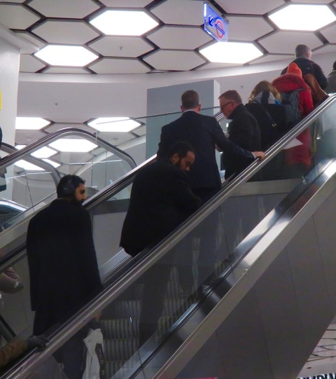 Barehanded on the escalator handrail. Who has been there before you?