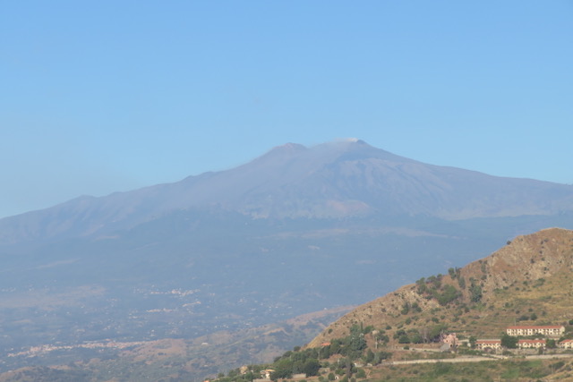 Behind me, an erupting Mount Etna