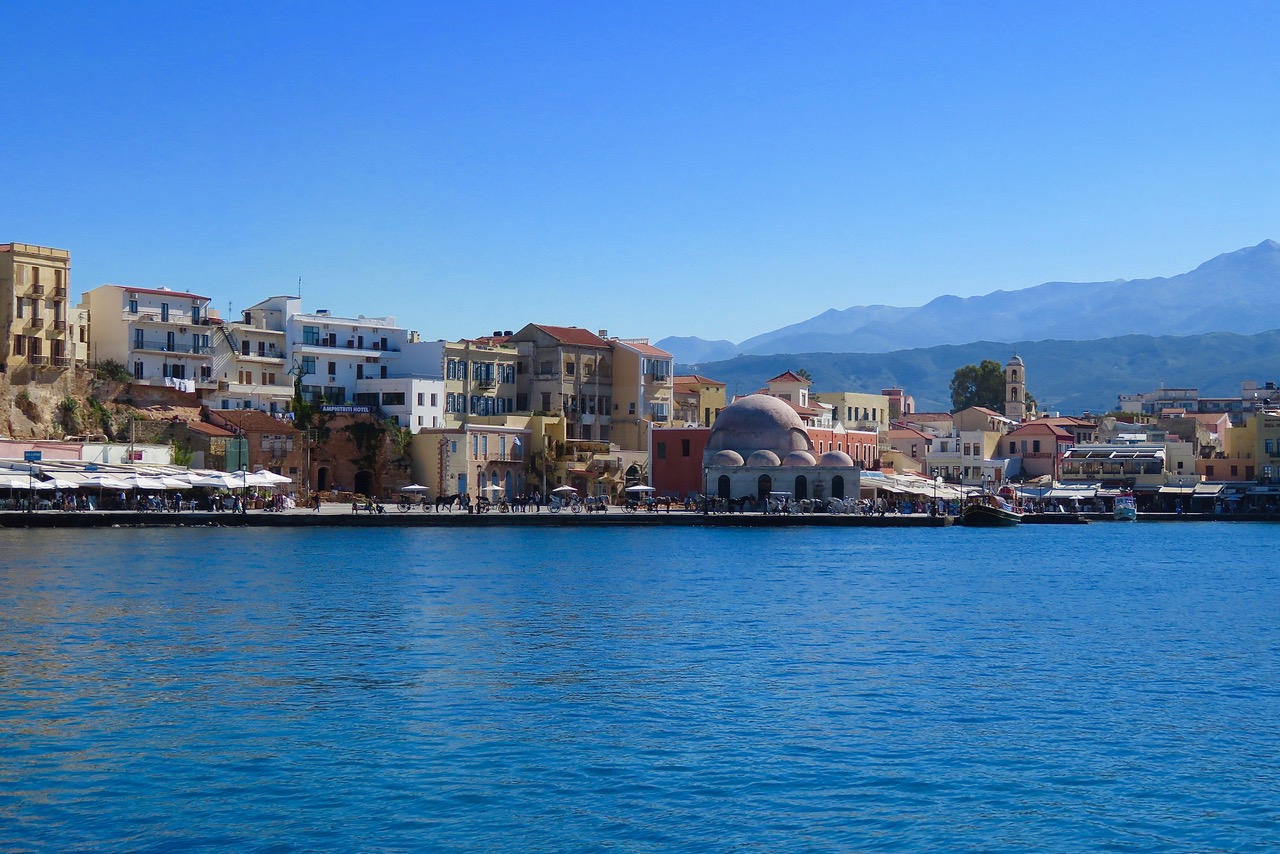 Chania's scenic harbour with Crete's White Mountains not far behind